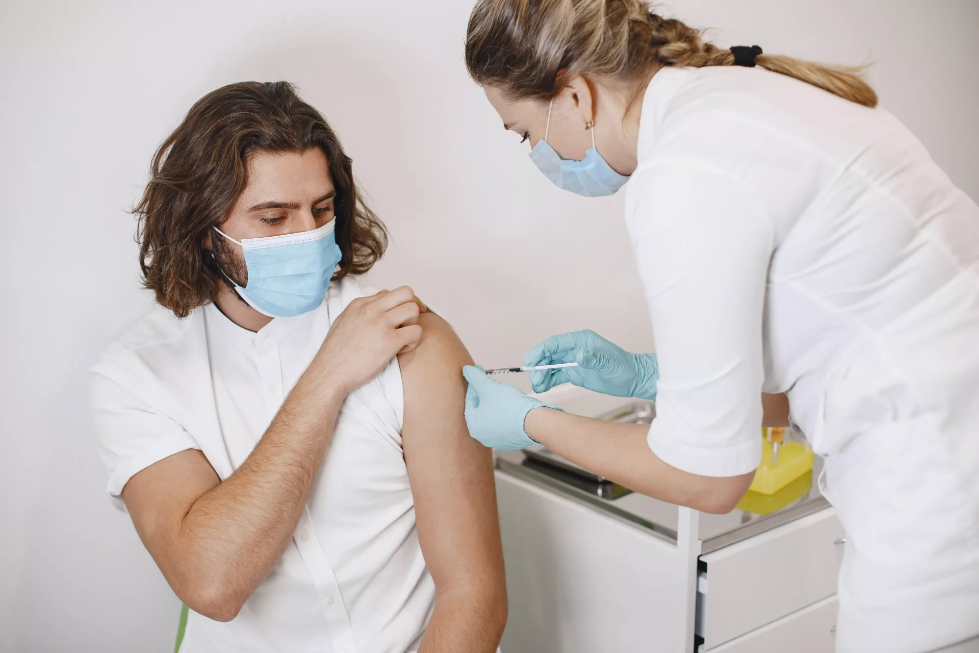 vaccination-healthcare-concept-hands-of-doctor-or-nurse-in-medical-gloves-healthcare-and-medical-concept